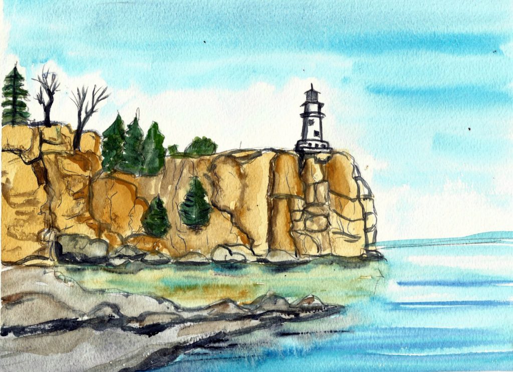 A lighthouse on a cliff overlooking Lake Superior.