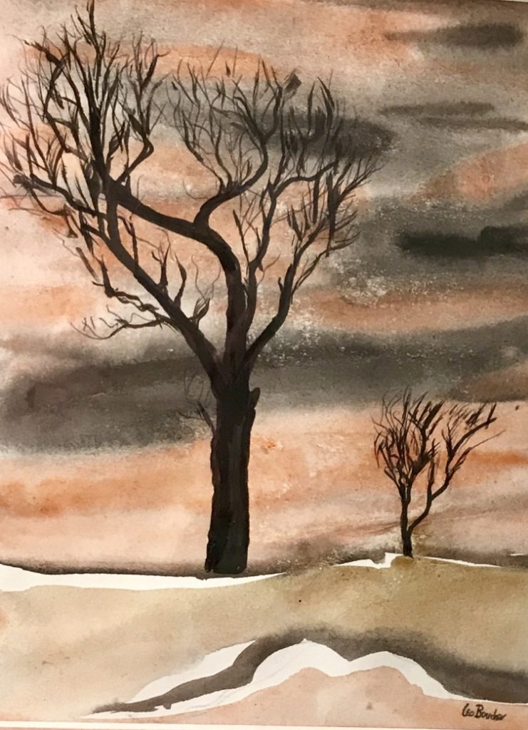 An atmospheric pink sky, set off by two barren trees.